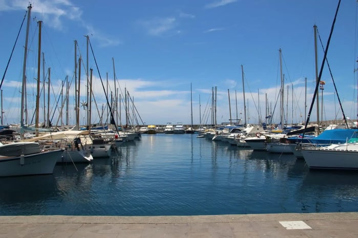 RAS - private-boats-parked-in-the-port-under-the-pure-blue-sky-scaled.jpg